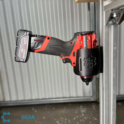 Milwaukee cordless power tool secured in the MGS-081 Holster by Metalgear Engineering—a rugged, 3D-printed tool holster designed for reliable mounting on walls, workbenches, or 80/20 framing in workshop and industrial environments.